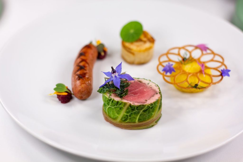 Exquisite gourmet dish featuring artistic presentation with vibrant colors and delicate ingredients.